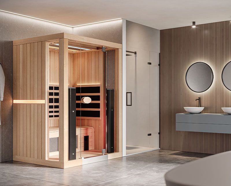 Modern bathroom with a glass sauna cabin, wood paneling, and a floating vanity with round mirrors