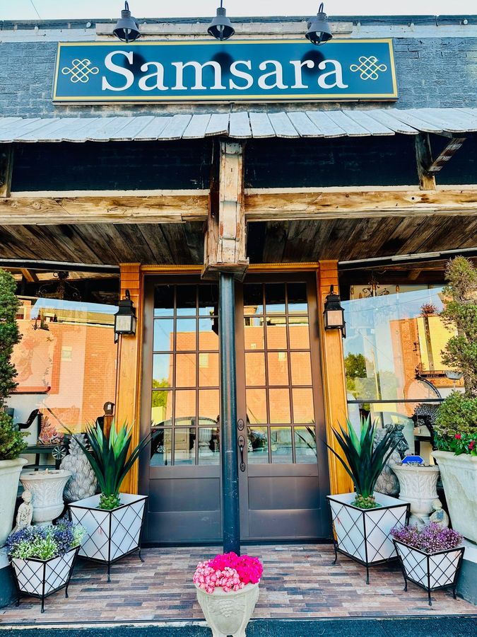 A store front with a sign that says samsara on it