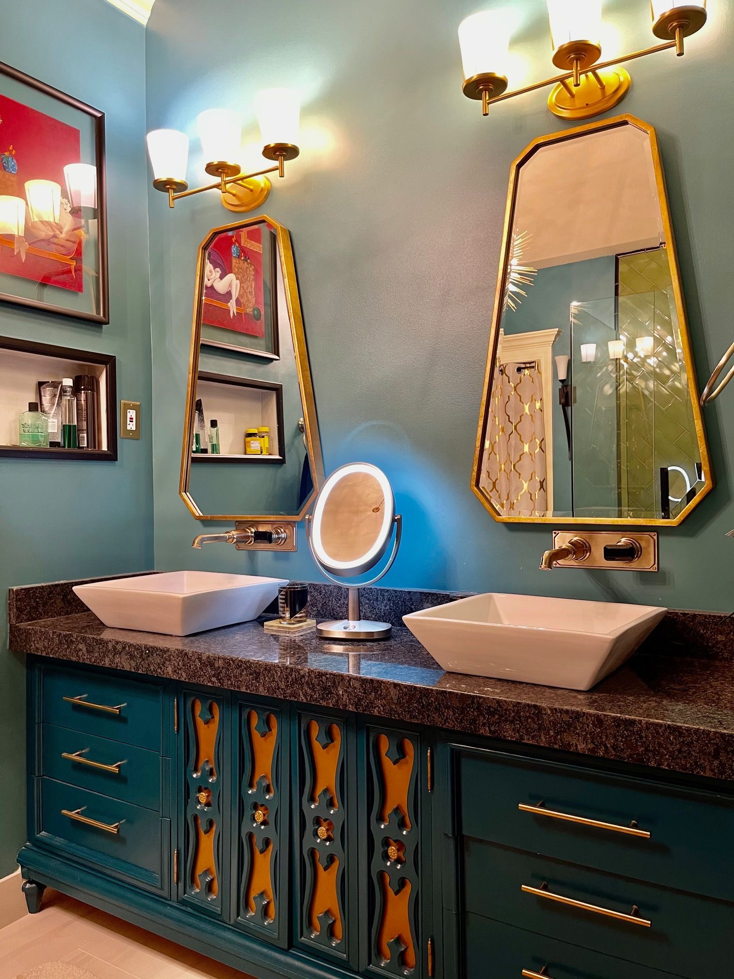 A bathroom with two sinks and two mirrors