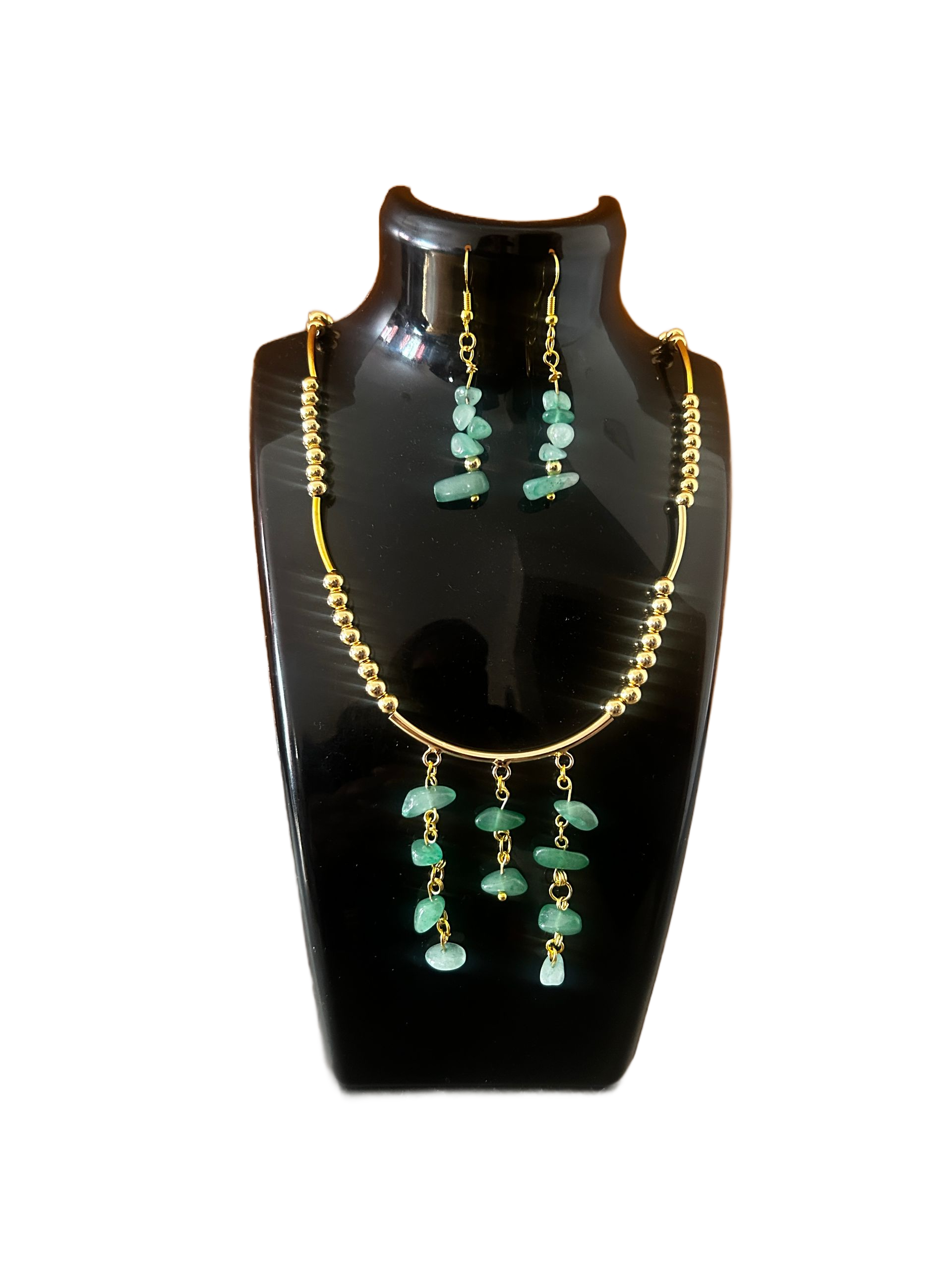 Black bust display with gold-and-turquoise necklace and matching earrings