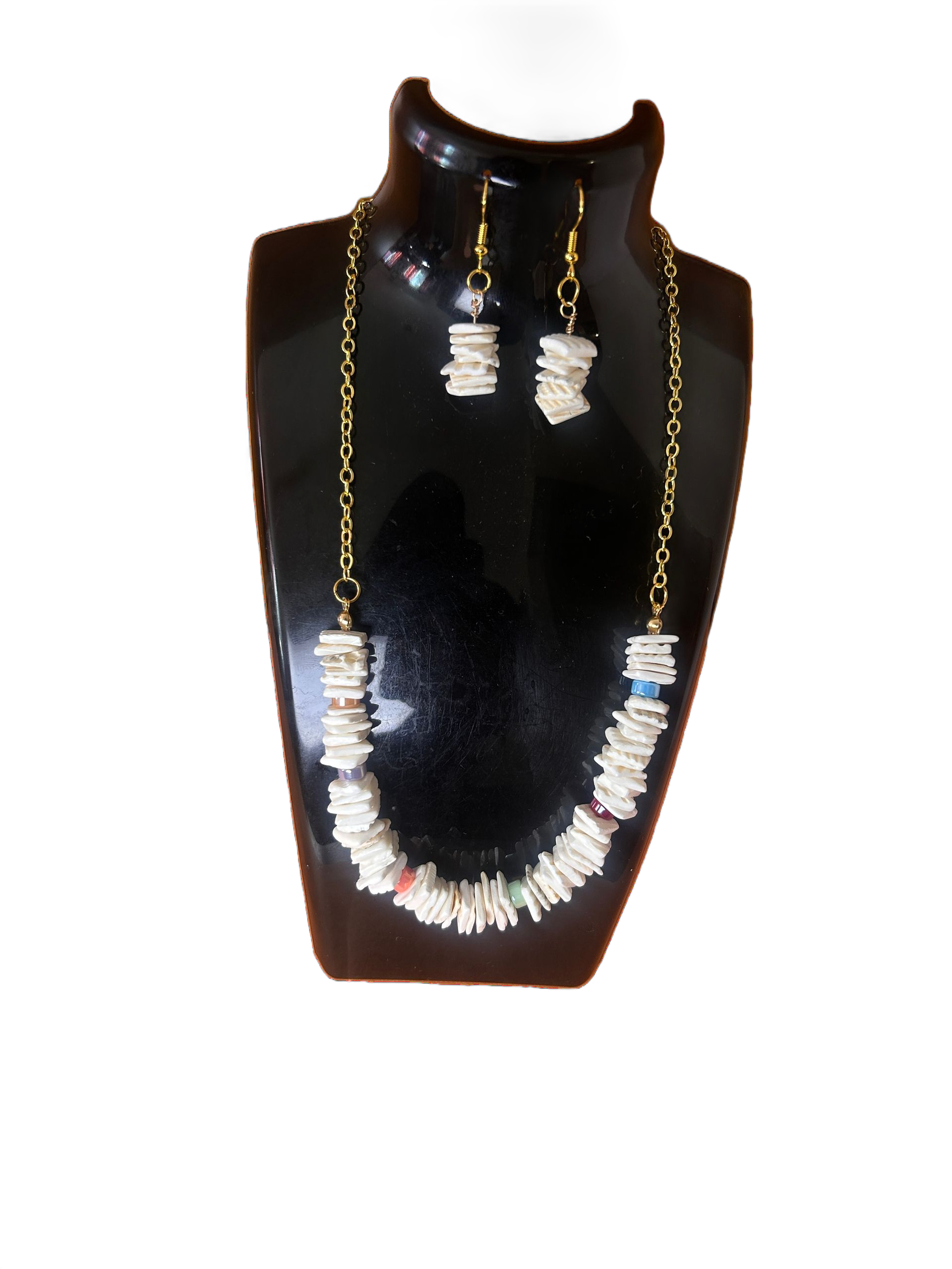 Black necklace display bust with gold and silver jewelry set