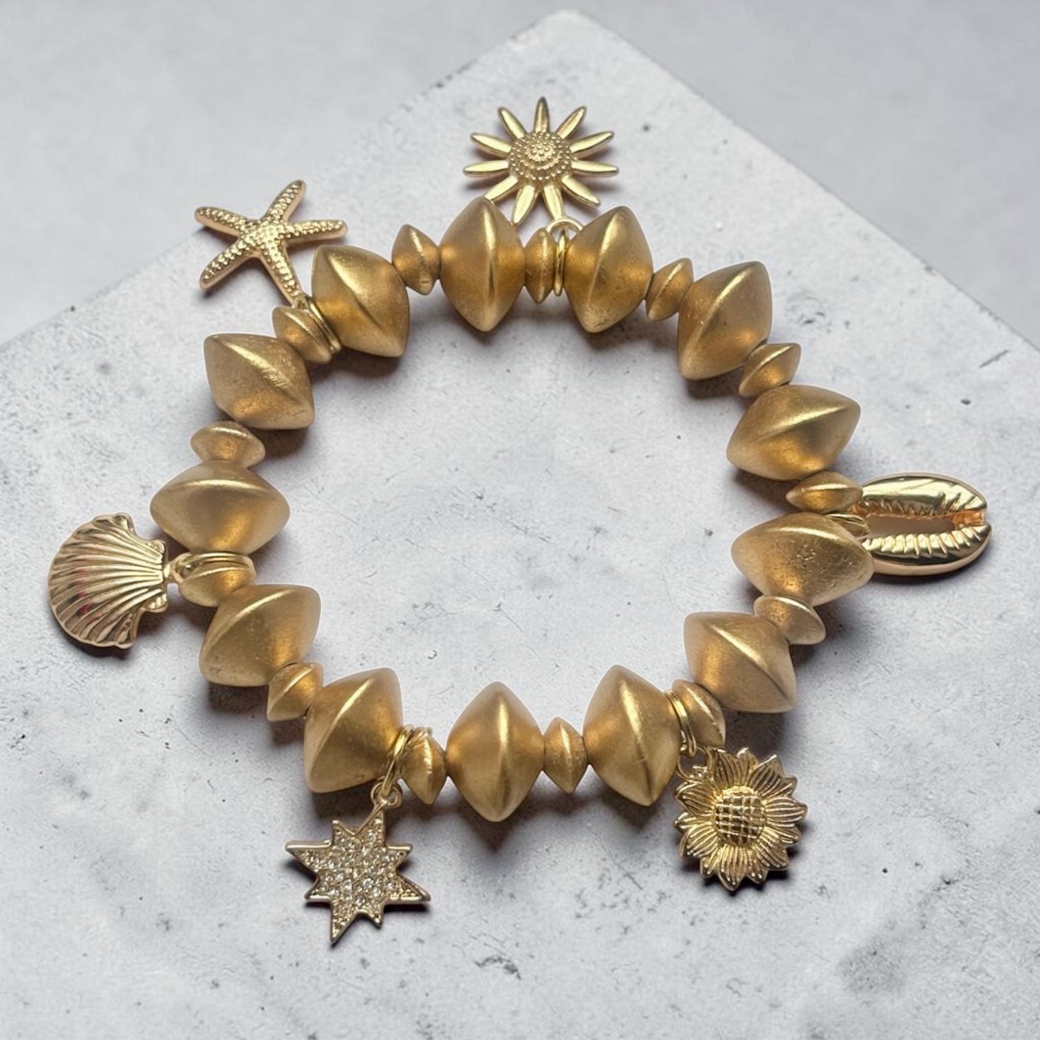 Chunky Gold Plated Wooded Stretch Bracelet with Charms