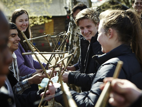 Explorer Scouts working together on a pioneering project, developing teamwork and leadership skills through outdoor activities.