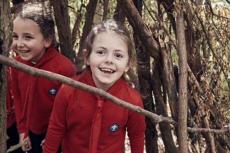 Squirrel Scouts enjoying outdoor play and adventure activities.