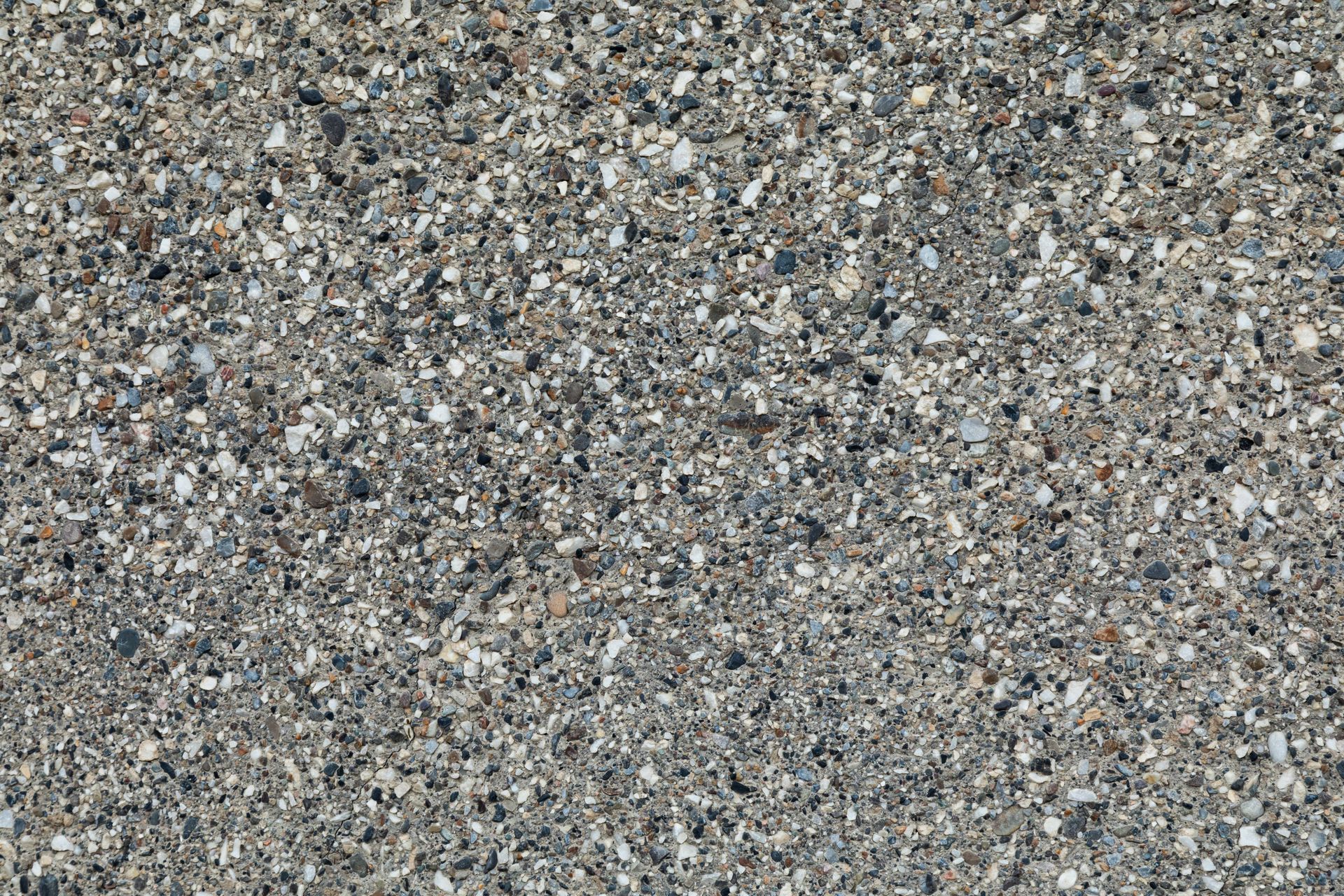 Gray gravel or crushed stone surface with small pebbles and speckled texture — King Reef Concrete in Kurrimine Beach, QLD