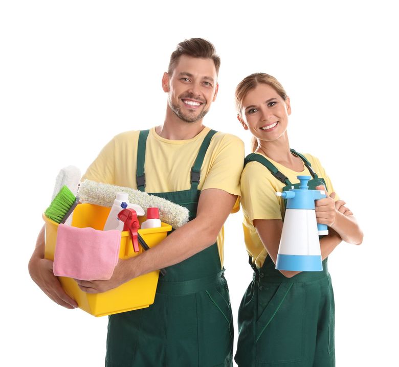 Two cleaners in green overalls holding cleaning supplies on a white background