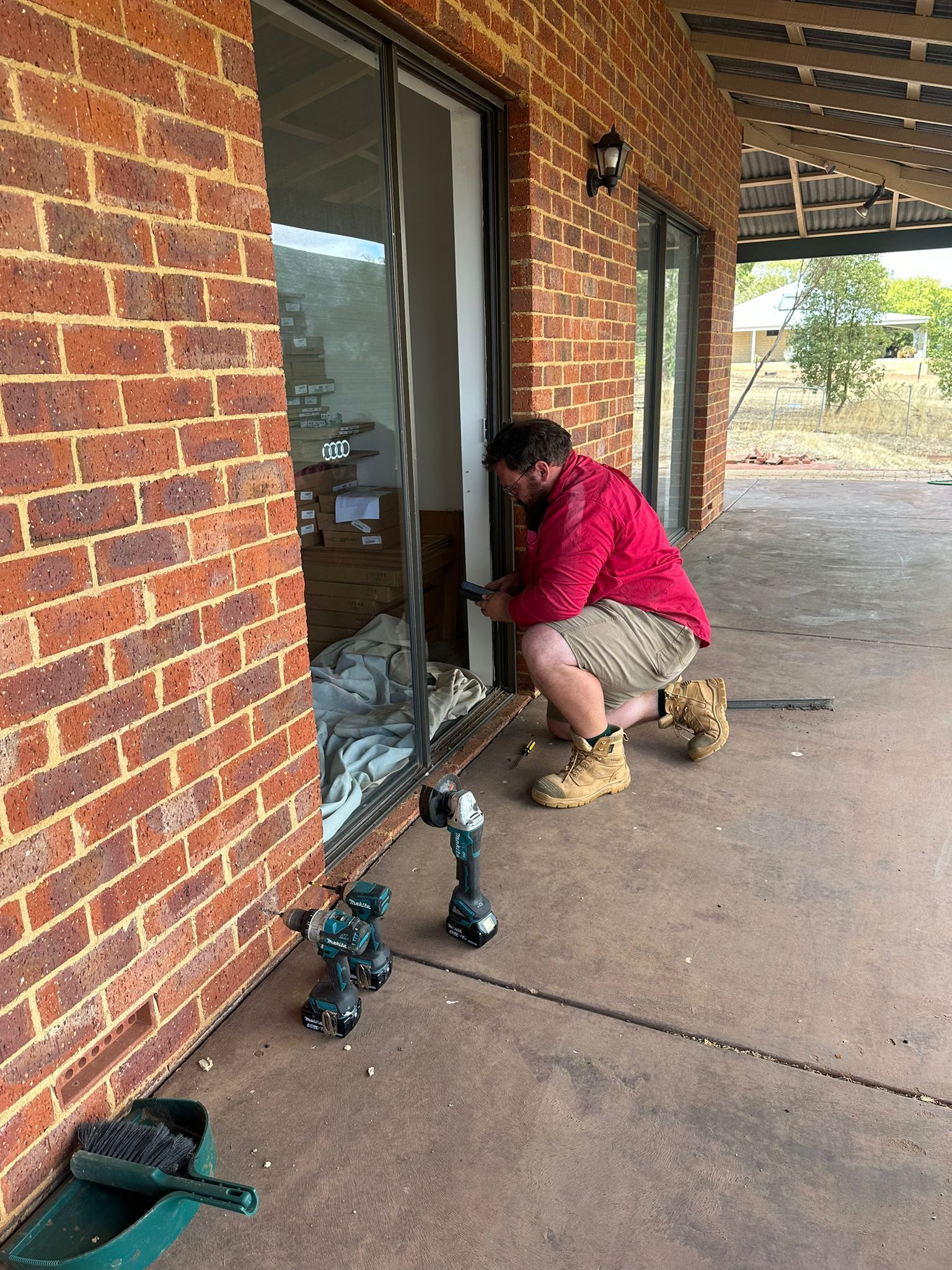 Ainsley from Toodyay Glass installing a new sliding door at a Bullsbrook residence.