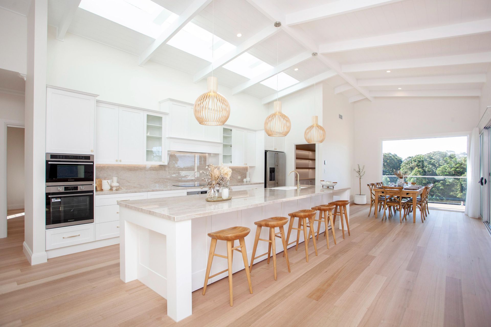 Bright, Open Kitchen With White Cabinets — Mid North Coast Drafting & Construction in Diamond Beach, NSW