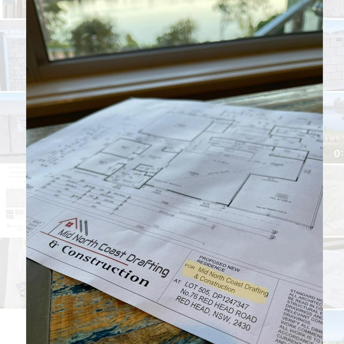 Architectural Blueprint on a Table — Mid North Coast Drafting & Construction in Forster, NSW