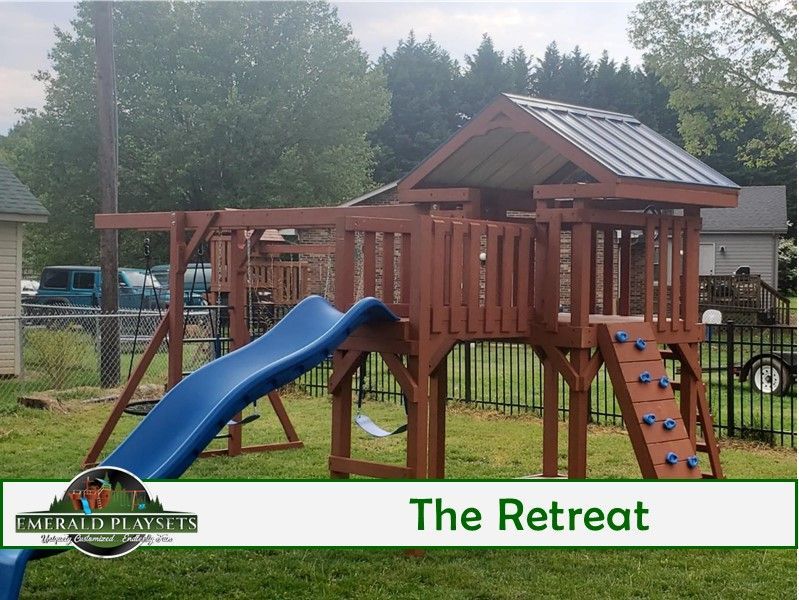 A picture of a playground with the words the retreat on the bottom