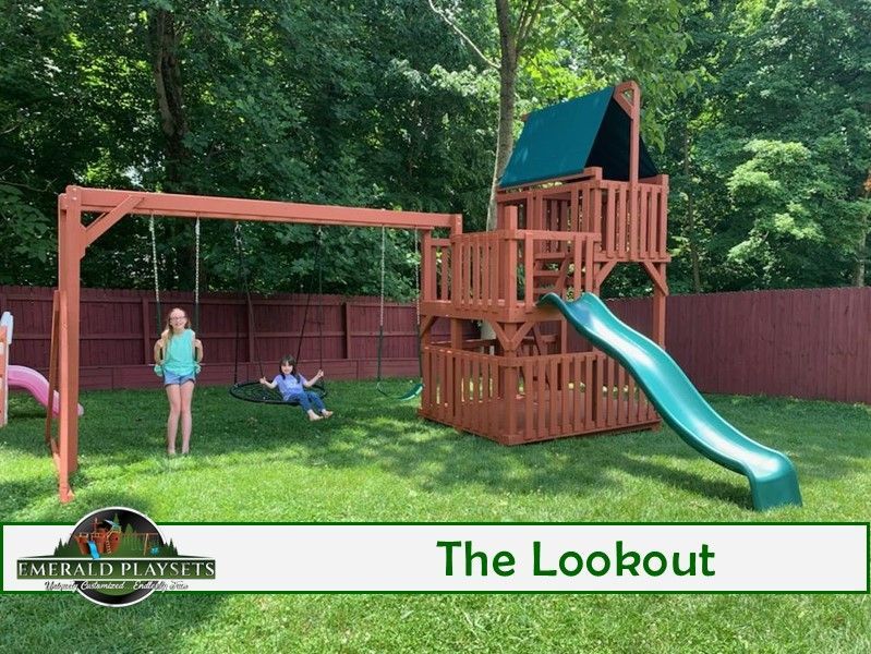 A children 's playground with a slide and swings called the lookout