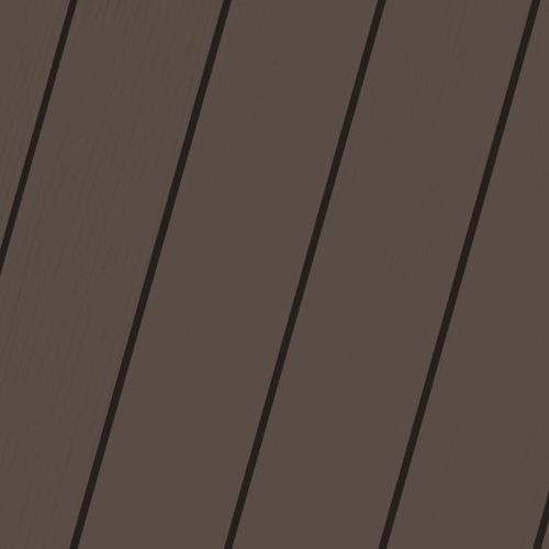 A close up of a dark brown wooden surface with black stripes.