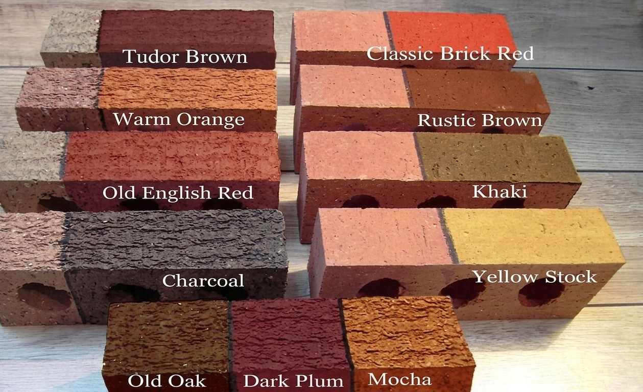Stacked painted wooden blocks labeled with different stain colors, including brown, red, black, yellow, and orange.