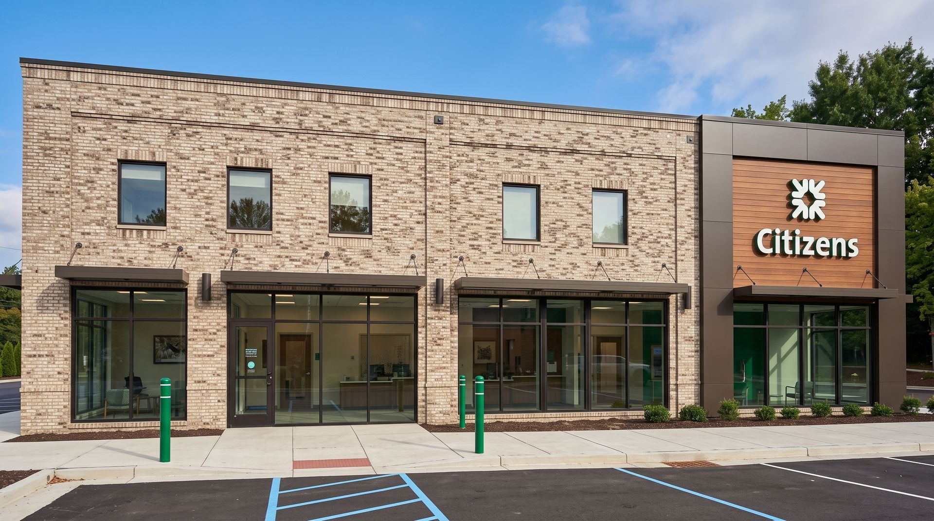 Partially built brick structure with arched windows, concrete floor, and construction tools on site