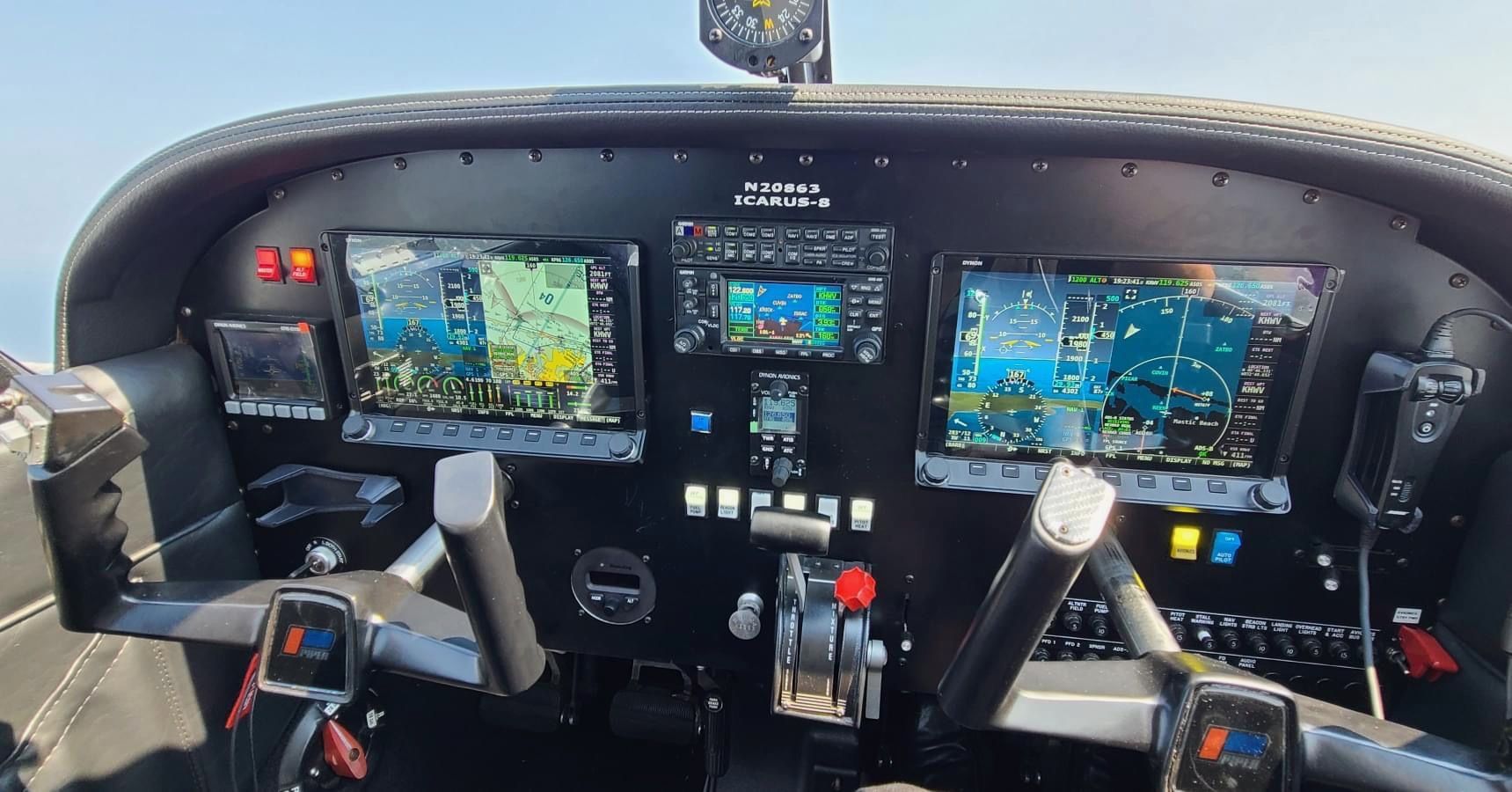 Detailed cockpit of Piper Archer flight training aircraft with dual controls for student and instructor safety