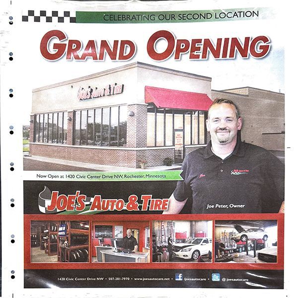 Advertisement: Joe's Auto & Tire grand opening at second location. Man smiles in front of shop. Shop has a red awning. | Joe's Auto and Tire