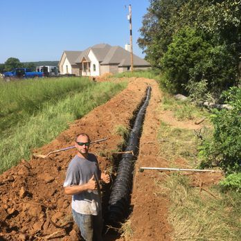 Septic system plumbing connection by Master Plumbing in West Fork Arkansas