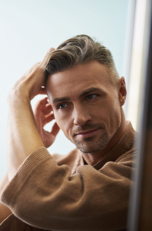 Man with thinning hair representing hair regeneration and hair restoration treatment