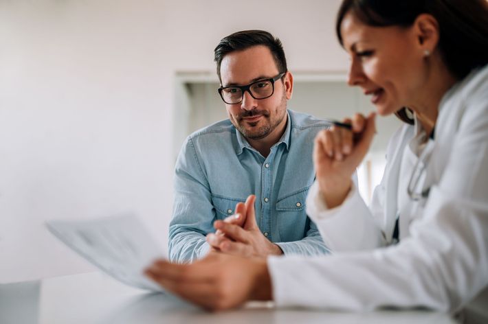 Patient consulting with medical provider about personalized aesthetic services