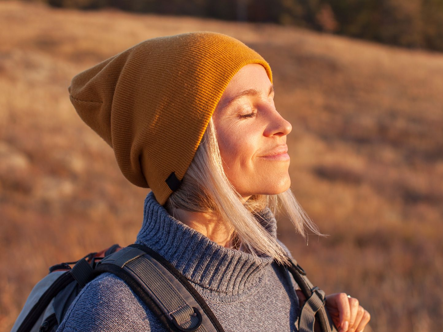 Woman outdoors with radiant skin representing refreshed skin after PRP microneedling treatment