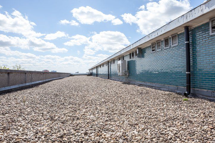 Gravel Roofing on Commercial Building — San Antonio, TX — Alexander’s Roofing Gravel Roofing on Commercial Building — San Antonio, TX — Alexander’s Roofing