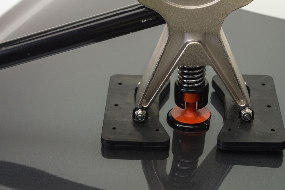 Close-up of a Metal Spring Clamp With Orange Suction — Kingston Panel & Paint in Huntingfield, TAS