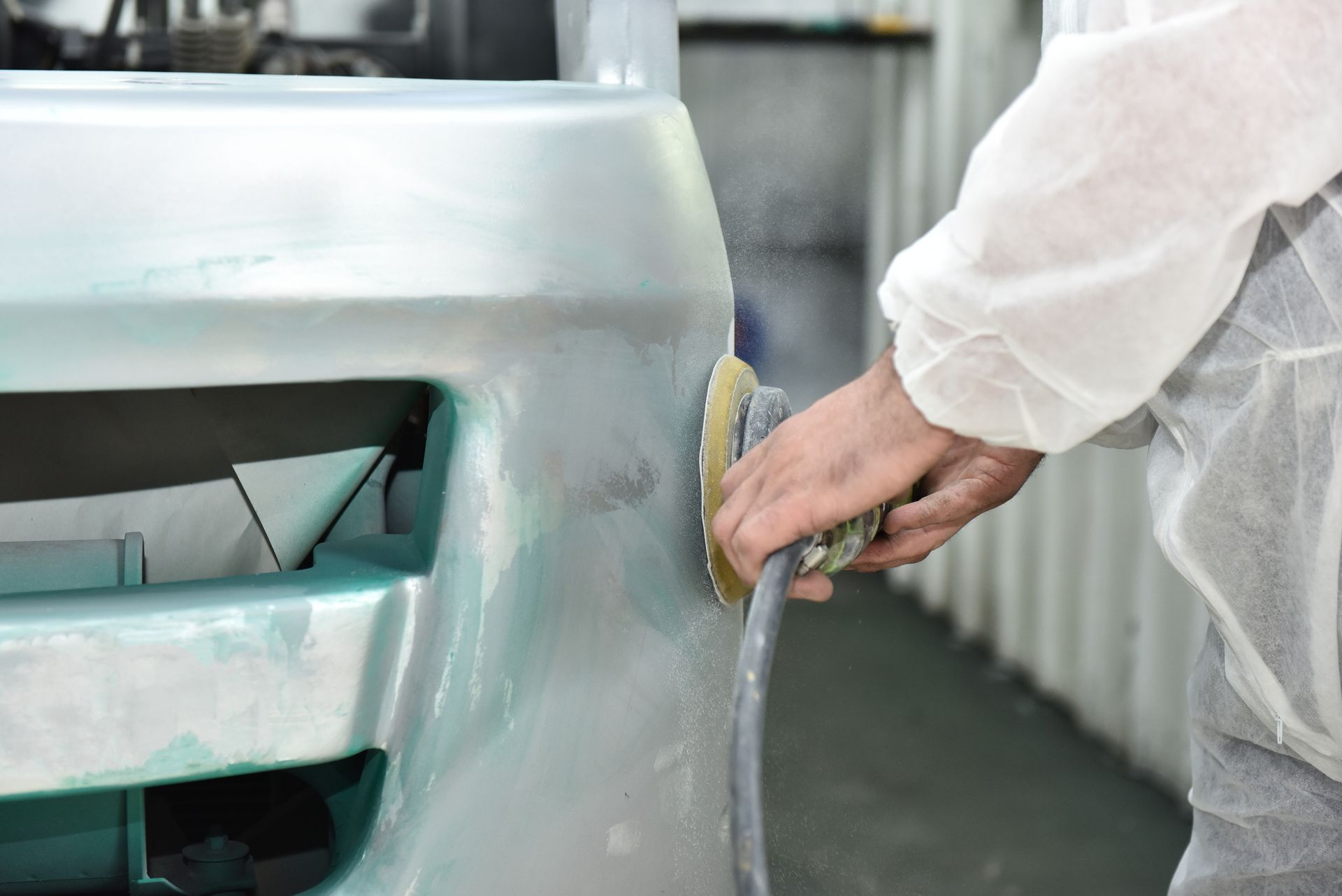 Gloved Worker Sanding a White Car Body Panel — Kingston Panel & Paint in Huntingfield, TAS
