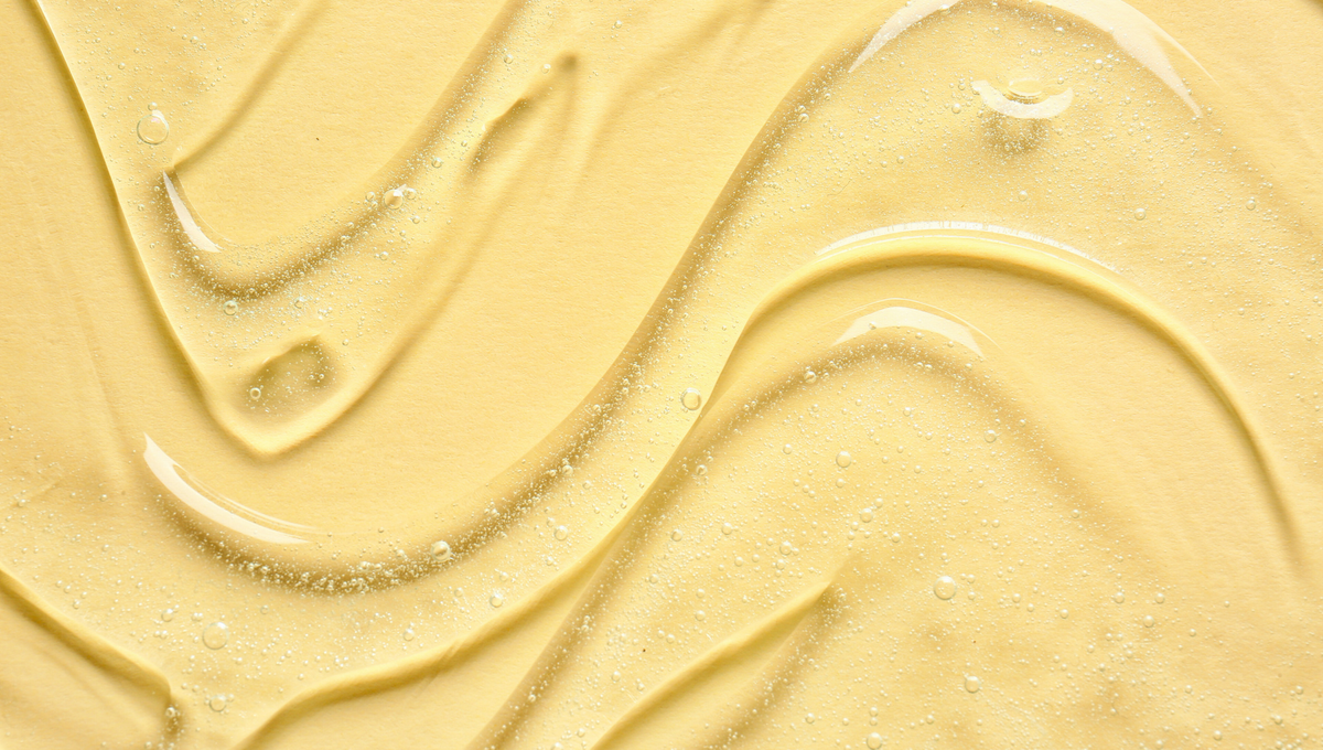 Yellow creamy swirls with a smooth, glossy texture and subtle sparkles