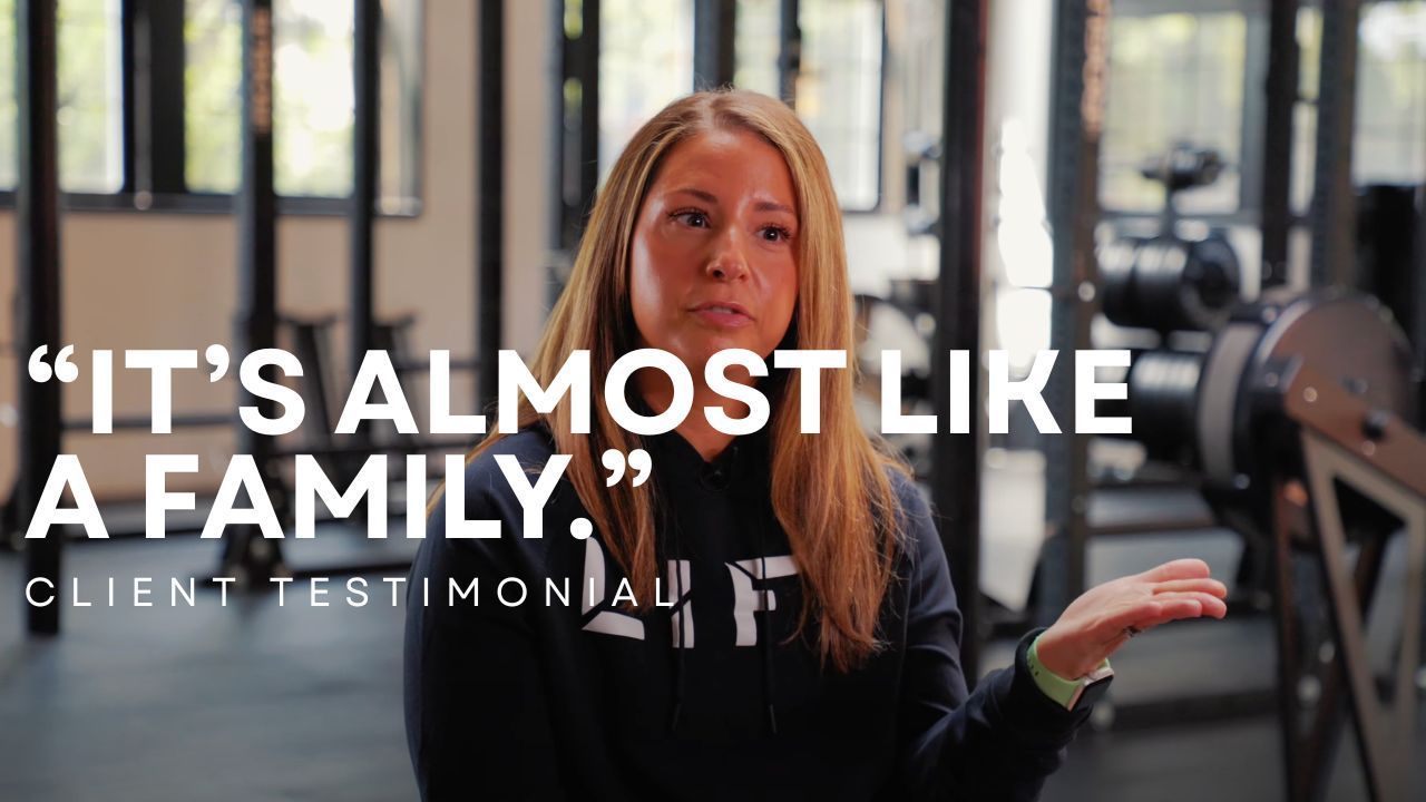 Woman speaking in a gym, with quote text overlay: “IT’S ALMOST LIKE A FAMILY.”