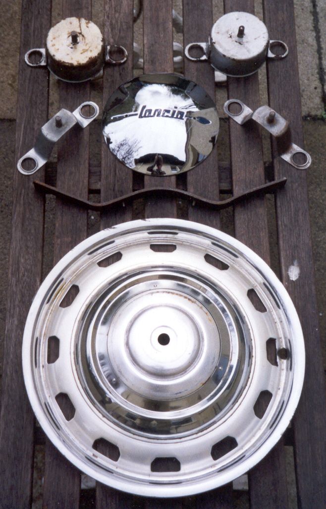 A stainless steel wheel with the word lancia on it