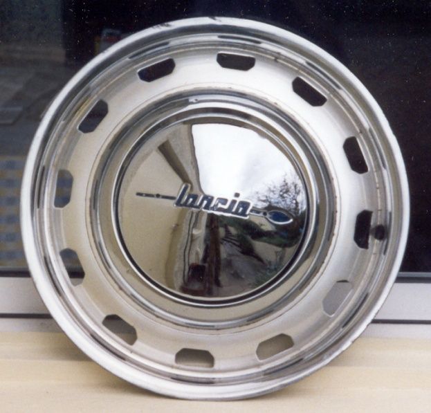 A chrome wheel with the word lancia on it