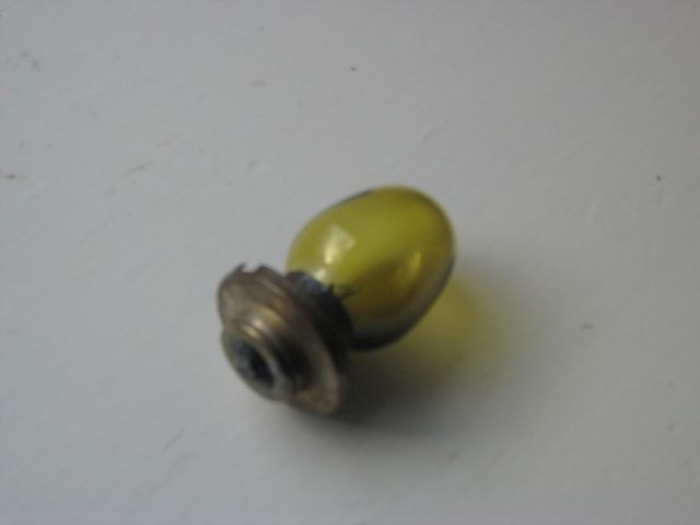 Yellow light bulb with a silver base.