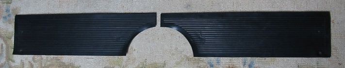 Two dark rectangular pieces, separated by a semi-circle cutout in the center.