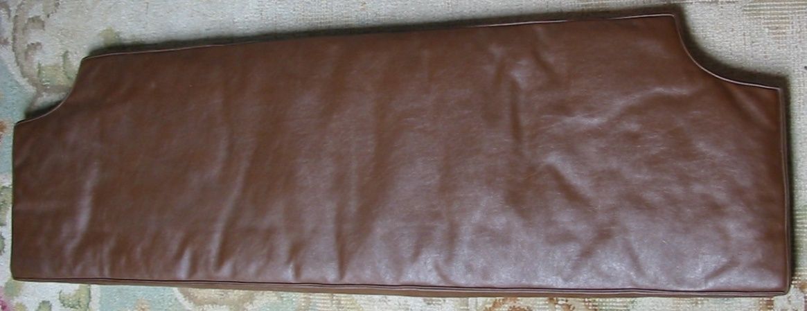 Brown leather piece with stitched edges; possibly a car part.