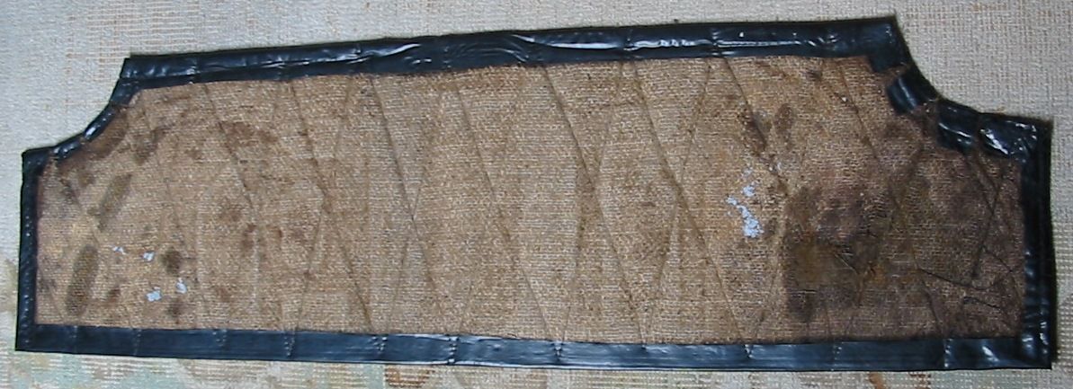 A brown rectangular object with a black border.