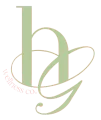 Light green stylized “h” and “g” monogram with “wellness co.” in a circular logo