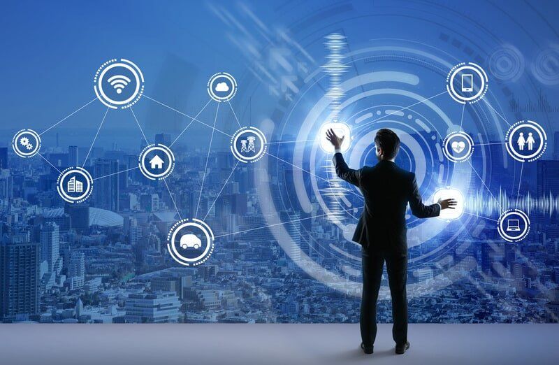 A Man In A Suit Is Standing In Front Of A Screen With Icons On It — Surveillance NQ In Aitkenvale, QLD