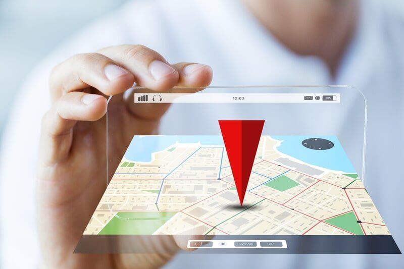 A Person Is Holding A Phone With A Map On It — Surveillance NQ In Airlie Beach, QLD