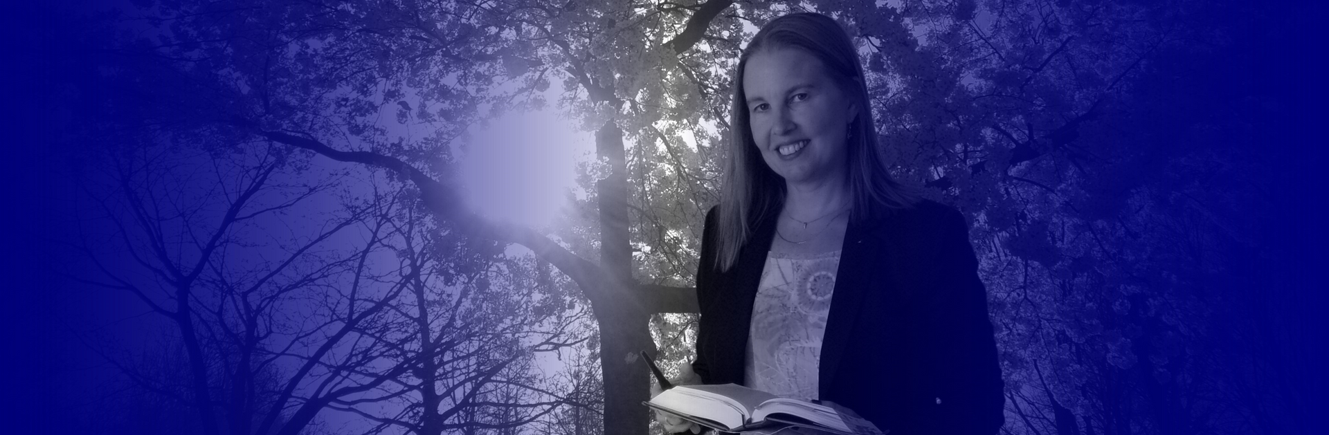 Lawyer (jurist) with law book standing in front of a tree in Voorne-Putten with an introduction of affordable services for entrepreneurs and freelance services.