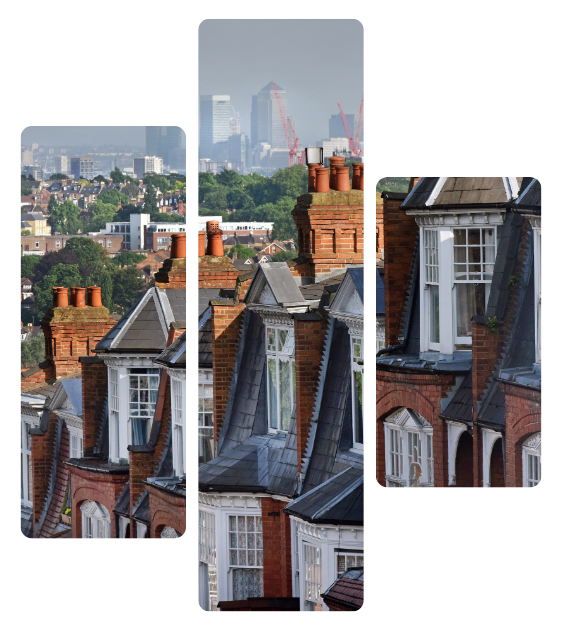 Row of London rooftops and chimneys with a hazy city skyline in the background