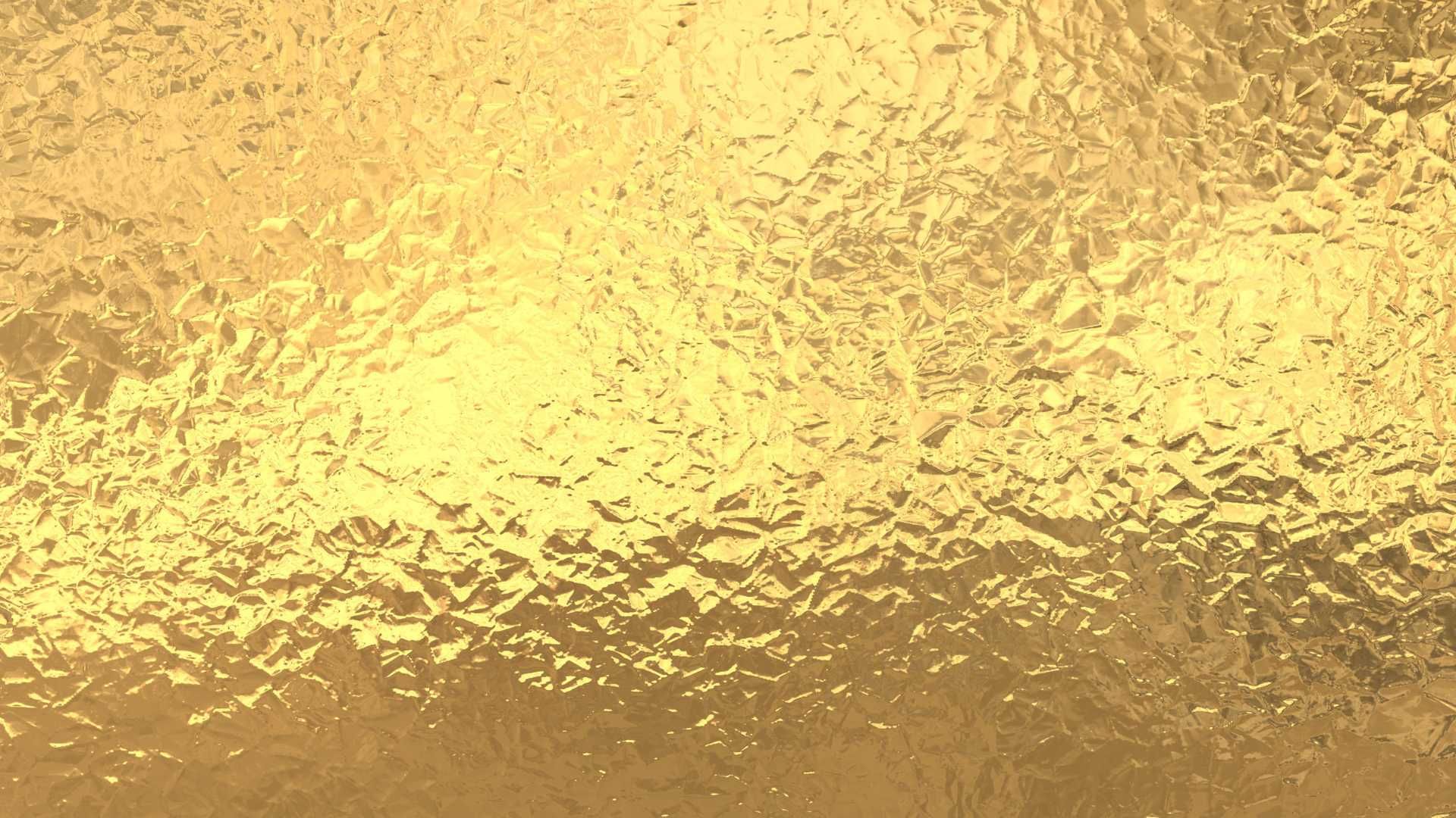 A close up of a gold foil texture.