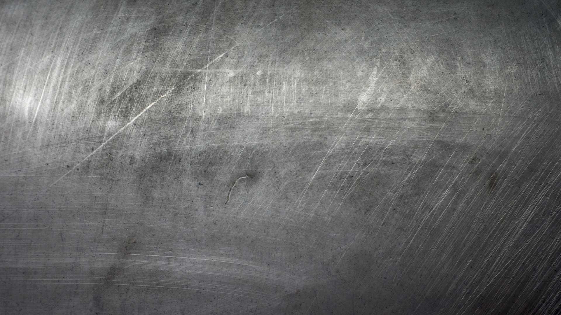 A close up of a blackboard with a lot of scratches on it.