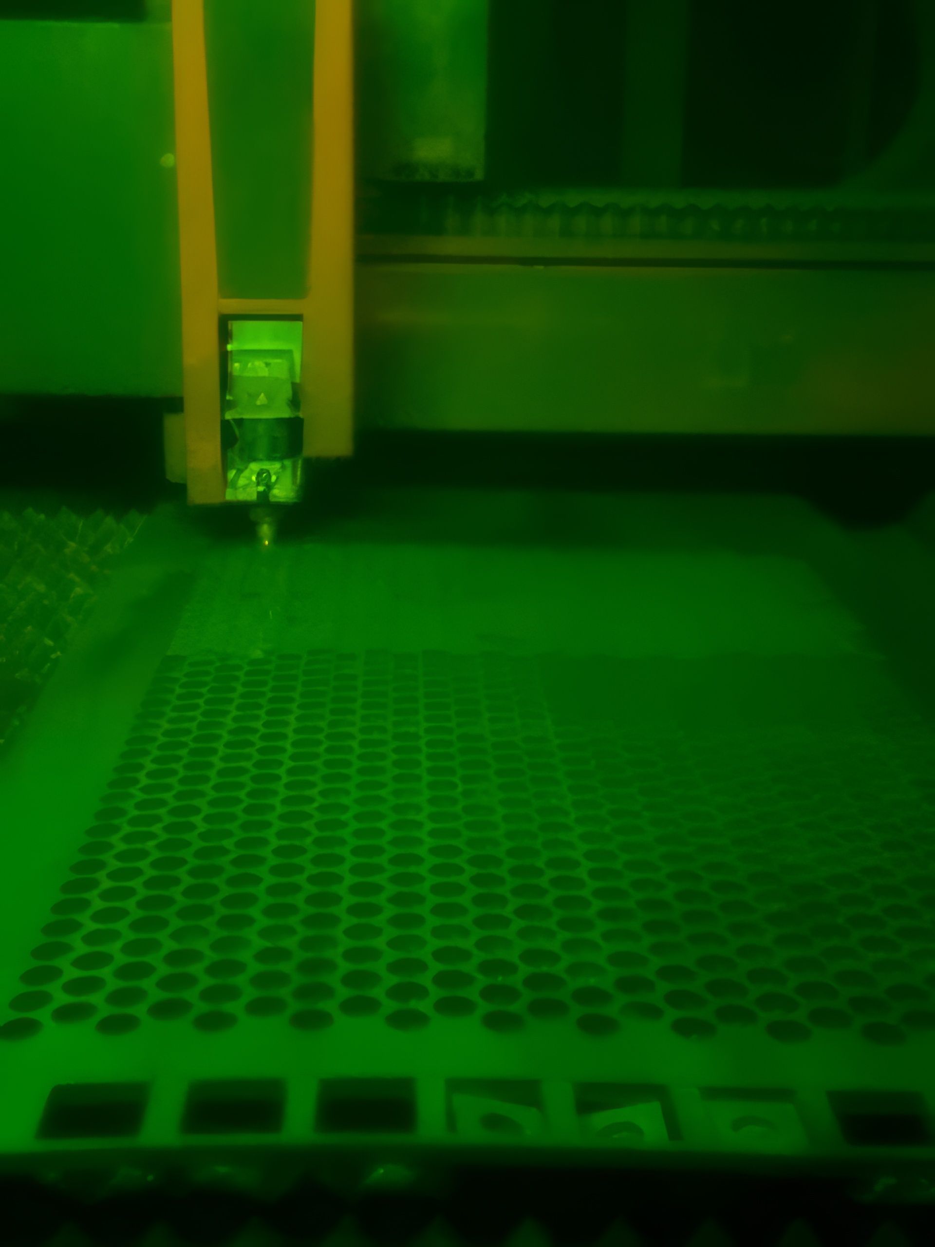 A green light is shining on a green surface.