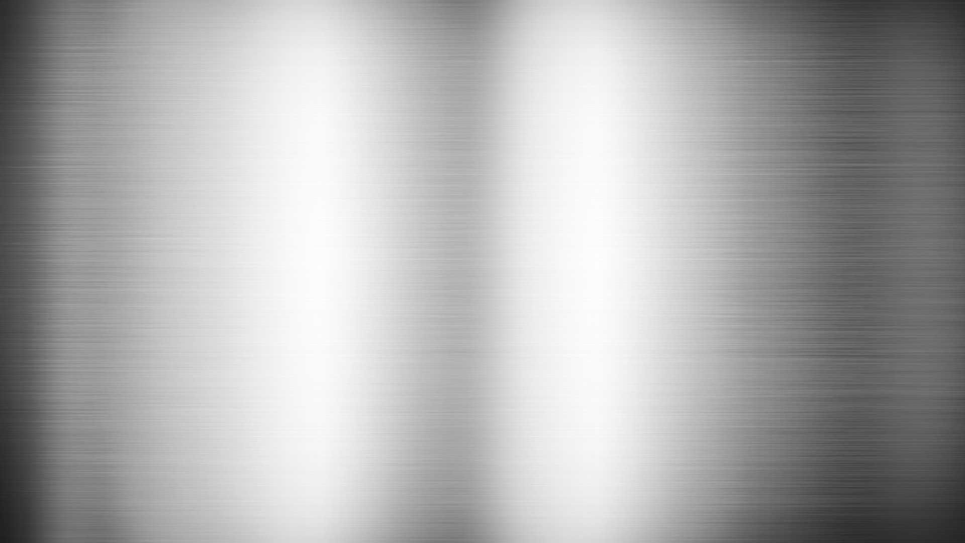 A close up of a stainless steel texture on a white background.
