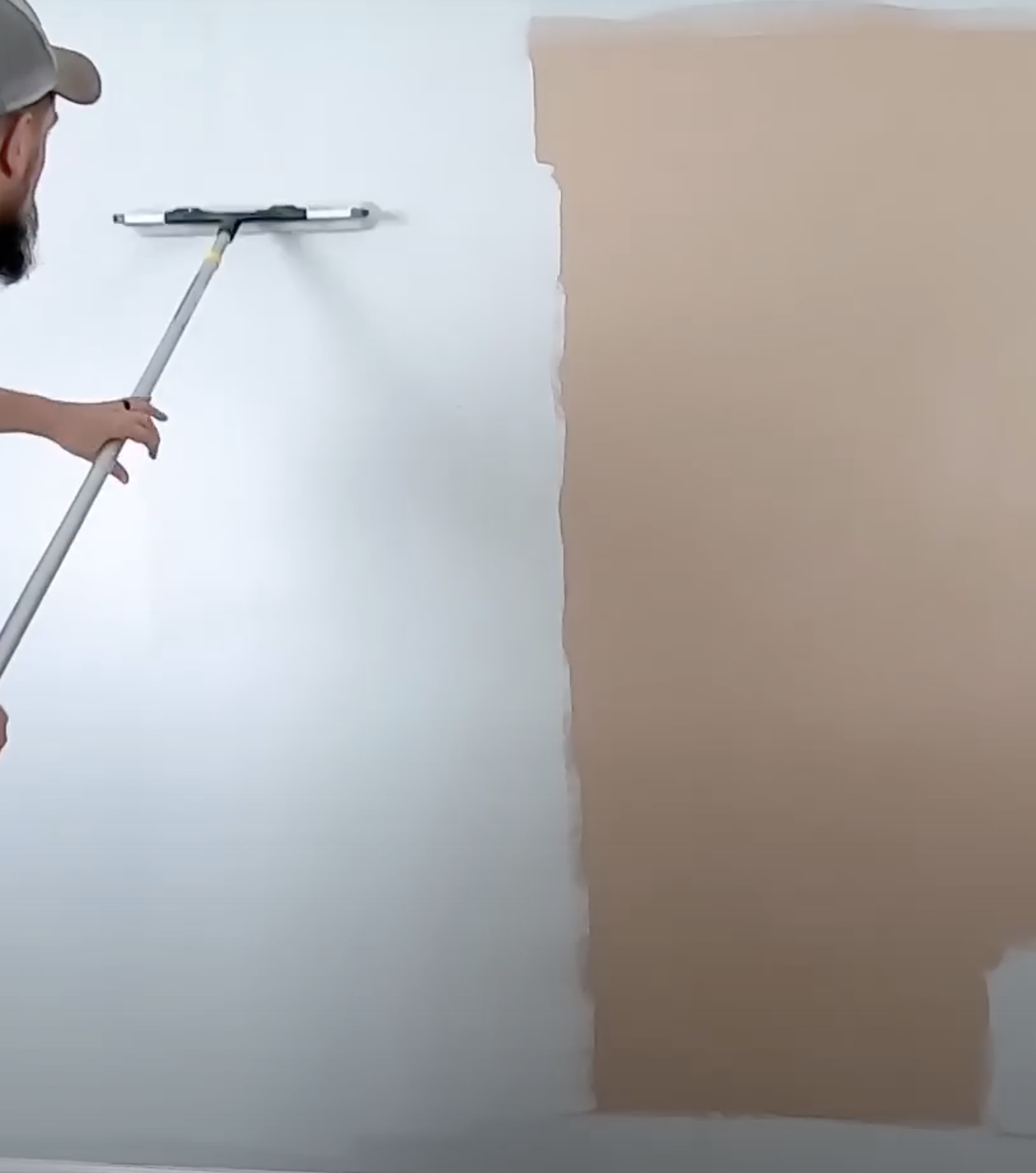 Picture showing us painting a house in Quinte