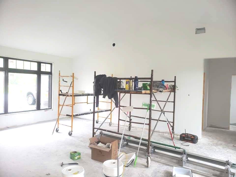 Pictured is a room freshly drywalled in a new house
