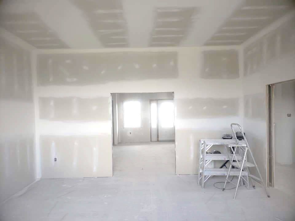 A picture of fresh sheetrock installation