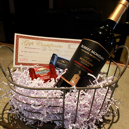 One bottle of wine with two Ghirardelli chocolate