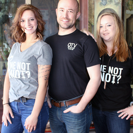 Three people wearing Wine Not Minot shirt