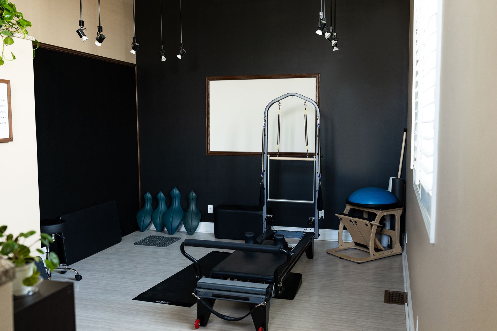 A room with a pilates machine and modern design
